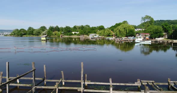 Aerial drone video of small docks, fishing boats and fishing village at the lake, Varna  Bulgaria