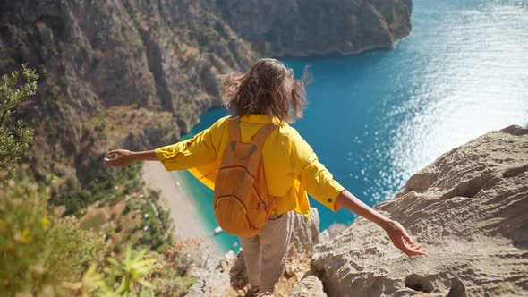 Slow Motion Happy Traveler Freedom Filling Woman with Open Arms Smiling and Enjoying Sea Coast View