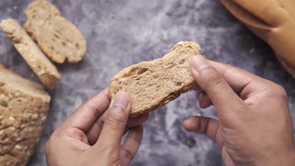 Holding Slice of Baked Bread Close Up