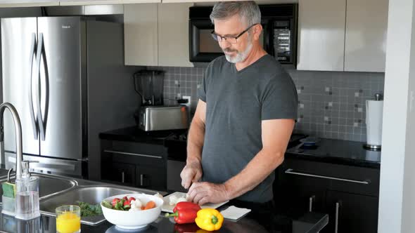 Man cutting vegetable in kitchen 4k