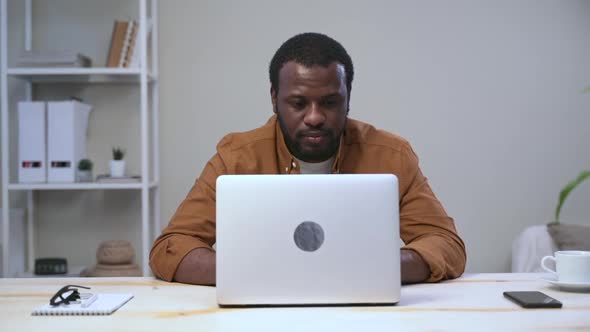 African Man After Laptop Looks to Side to Relax From Work Fatigue Spbas