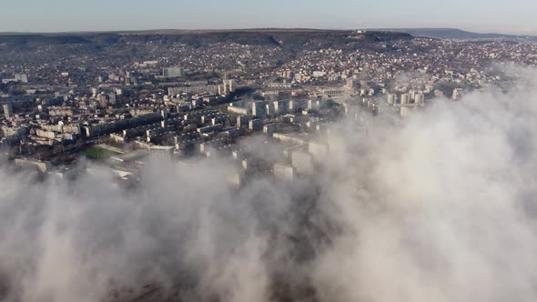 the City in the Fog at the Summer Day Aerial View