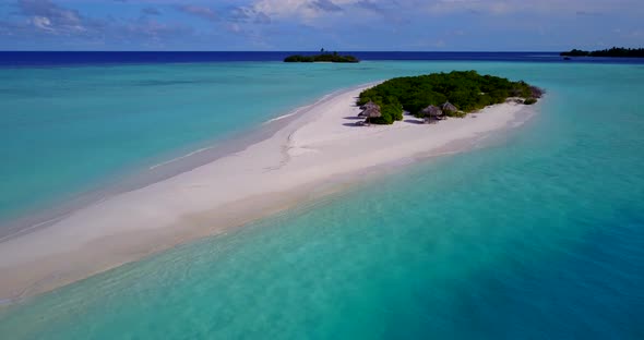 Luxury aerial clean view of a paradise sunny white sand beach and blue ocean background in vibrant 4