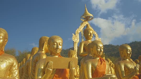 Close Up Golden Disciple Statues Of Big Buddha