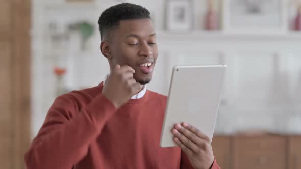 Portrait of Video Call on Tablet by African Businessman in Office