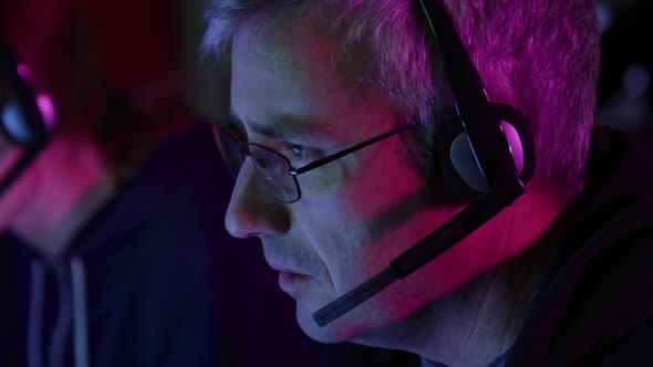 Caucasian man typing on computer keyboard in a creative office