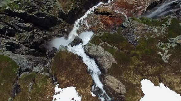 Flying over amazing tall waterfall in Norway, aerial footage