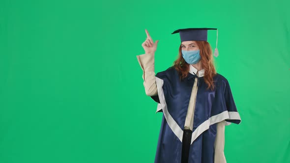 Graduation in Quarantine University Graduate Rejoices at Diploma and Shows Hand to Side for