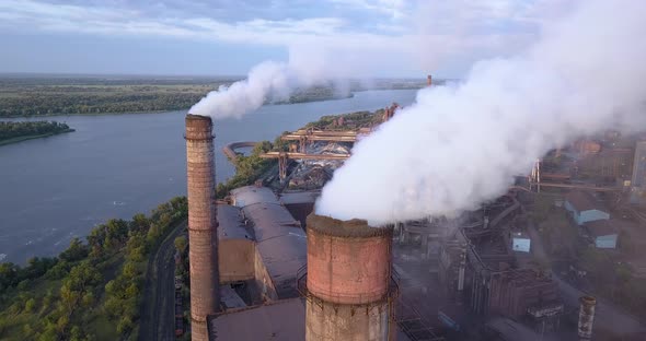 Aerial View of Industrial Zone with a Large Pipe Thick White Smoke