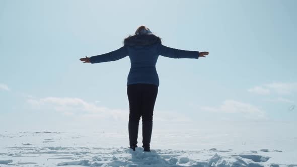 Girl Falls Into the Snow During the Day