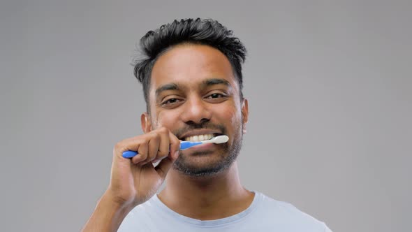 Indian Man with Toothbrush Cleaning Teeth 43