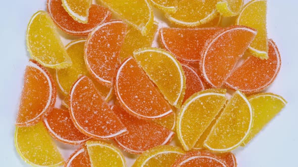 Tasty Orange Gummy Marmalade Fruit Jelly Sprinkled with Sugar Candies Rotate Slowly