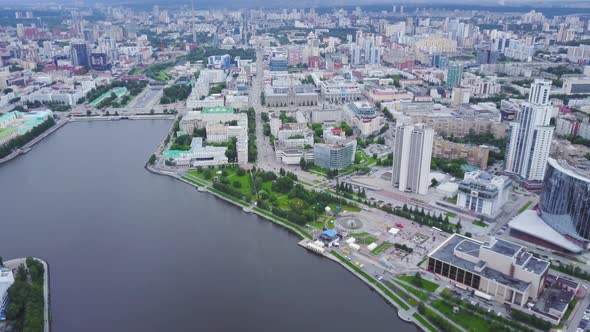 Top view of modern city with river in center