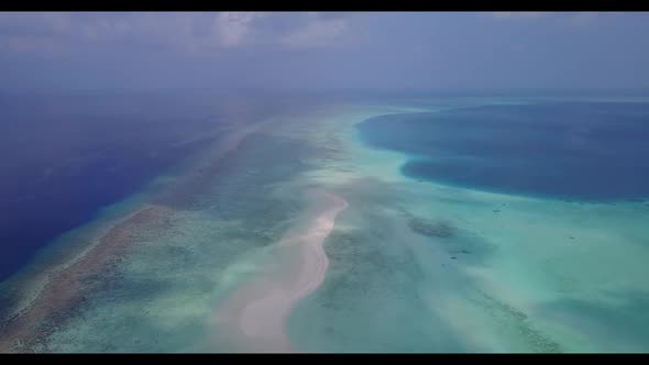 Aerial flying over texture of tropical coastline beach journey by blue sea and white sandy backgroun