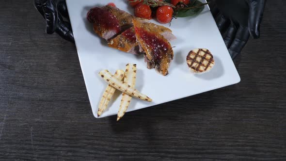 Restaurant Food Concept. Chef Presenting His Food Plate in Kitchen of Restaurant. Close Up. Cooking