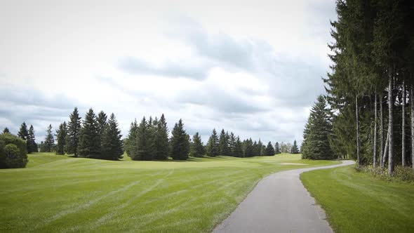 Driving through a beautiful golf course's fairway.