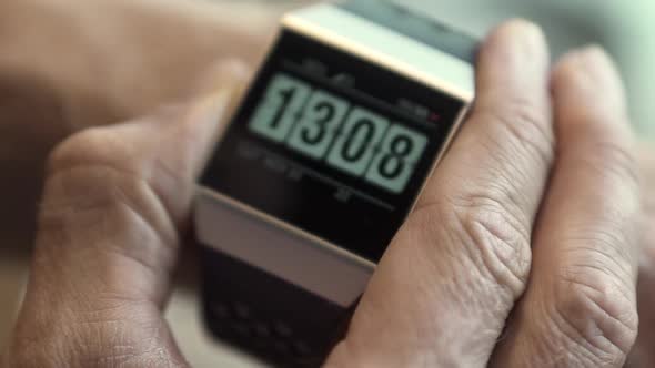 Closeup of a Fitbit Ionic Fitness Tracker on a Man's Wrist