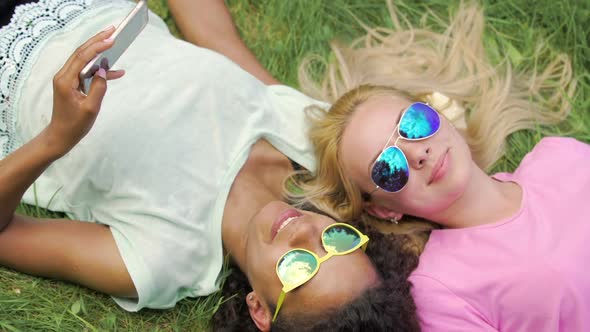 Relaxed Happy Girls Taking Selfies on Smartphone, Smiling and Enjoying Holidays