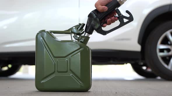 Filling Up a Jerrycan Fuel Container at a Petrol Station 15