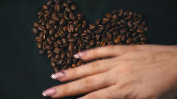 Coffee Beans Lie in the Form of a Heart Their Female Hand Cleans Them