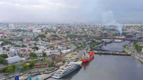 Luxurious yacht moored in Don Diego harbor with Santo Domingo city in background, Dominican Republic