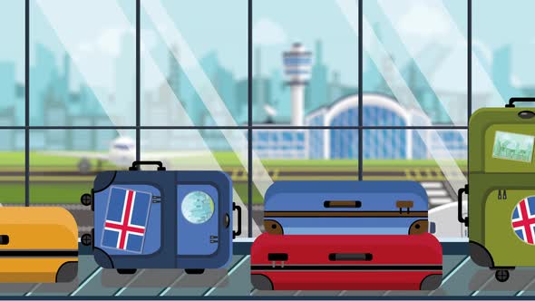 Suitcases with Icelandic Flag Stickers on Baggage Carousel