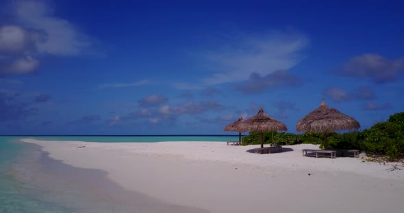 Tropical aerial copy space shot of a paradise sunny white sand beach and blue ocean background in co