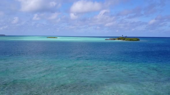 Aerial sky of resort beach by blue ocean with sand background