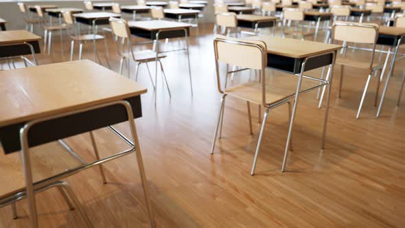 Seamless looping animation of endless rows of desks with chairs. Empty classroom