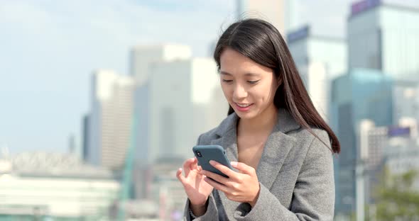 Business woman work on mobile phone at outdoor