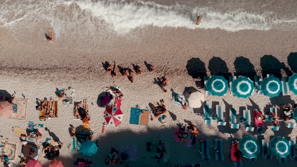 Lined Beach Umbrellas on a Italian Beach Downward View From Drone