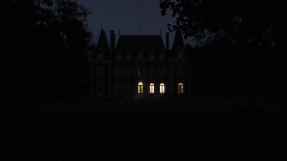 establishing shot of haunted old scary creepy castle at night