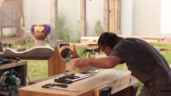 Joiner Works in his Open Air Shop