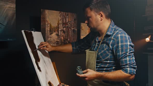 Drawing a Man in an Apartment in the Evening a Creative Hobby of the Artist Working in a Home Studio