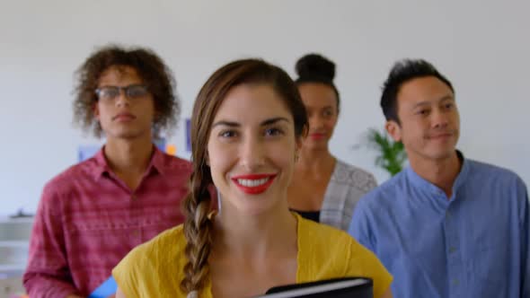 Happy multi-ethnic business colleagues walking together in modern office 4k