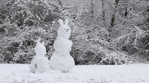 Snowman Rabbits In Winter Forest