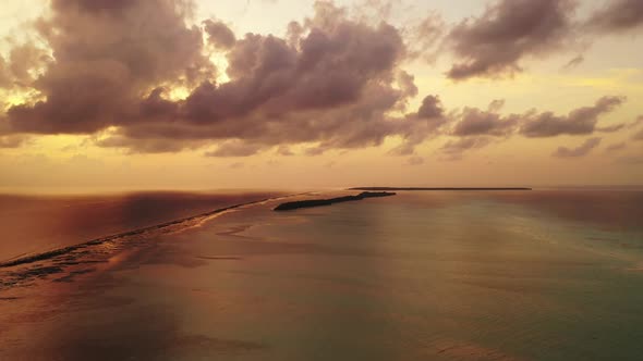 Aerial panorama of marine lagoon beach vacation by shallow ocean with clean sand background of a day