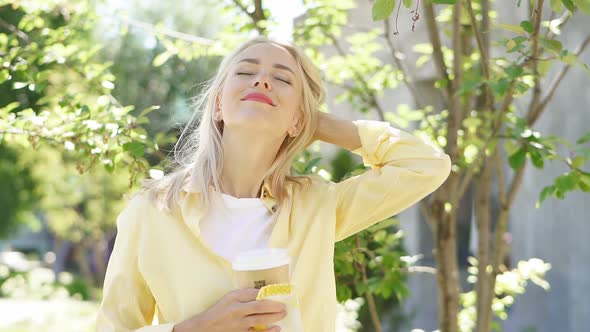 Charming Happy Woman Enjoys Sunny Day