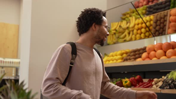 Vegan Buyer Choosing Fresh Vegetables in Farm Shop