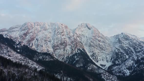 Frost Covered Mountain Summit In Winter - aerial shot