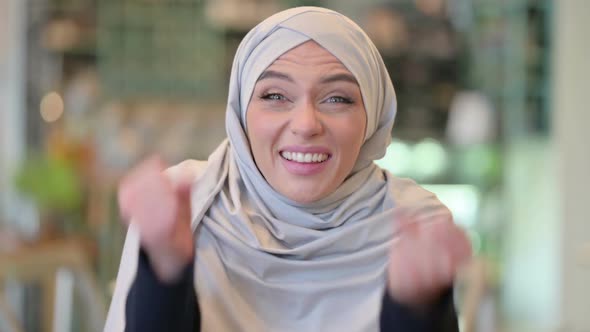 Portrait of Excited Young Arab Woman Celebrating Success