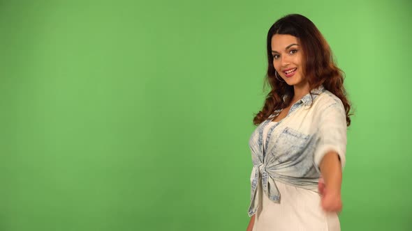 A Young Beautiful Caucasian Woman Shows a Thumb Up to the Camera with a Smile  Green Screen