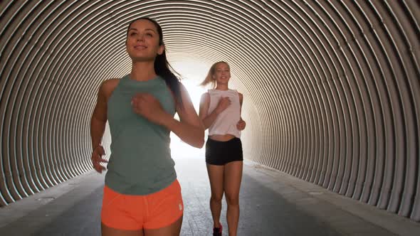 Young Women or Female Friends Running Outdoors