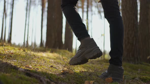 Close Up of Men Legs Hiking Steep Terrain in Slow Motion