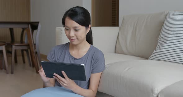 Woman use of tablet computer at home