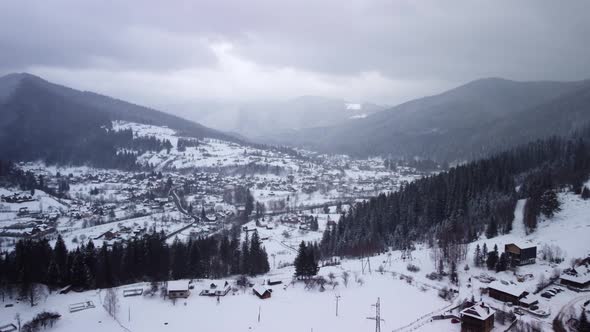 Aerial View of idyllic high-rise touristic place in Carpathian Mountains, winter season.