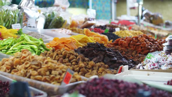 dried fruits and berries on the counter of the food market
