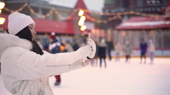 Christmas Ice Rink with a Brunette Girl