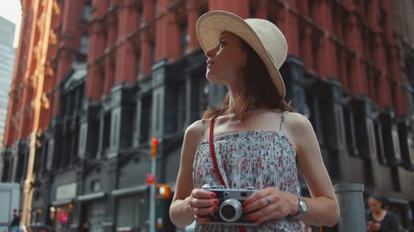 Young photographer with a camera in New York City