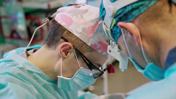 Medical team performing operation. Surgery team operating in surgical room